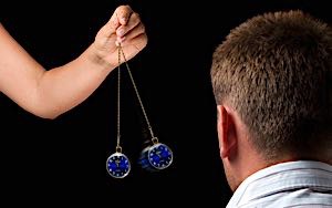 Woman trying to hypnotize man into liking her