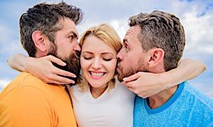 woman affectionate with two men